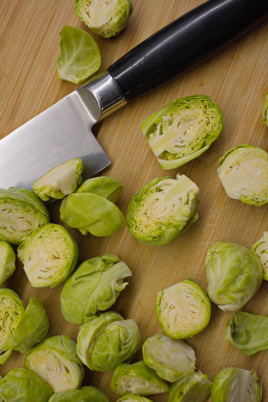 cut brussels sprouts on cutting board